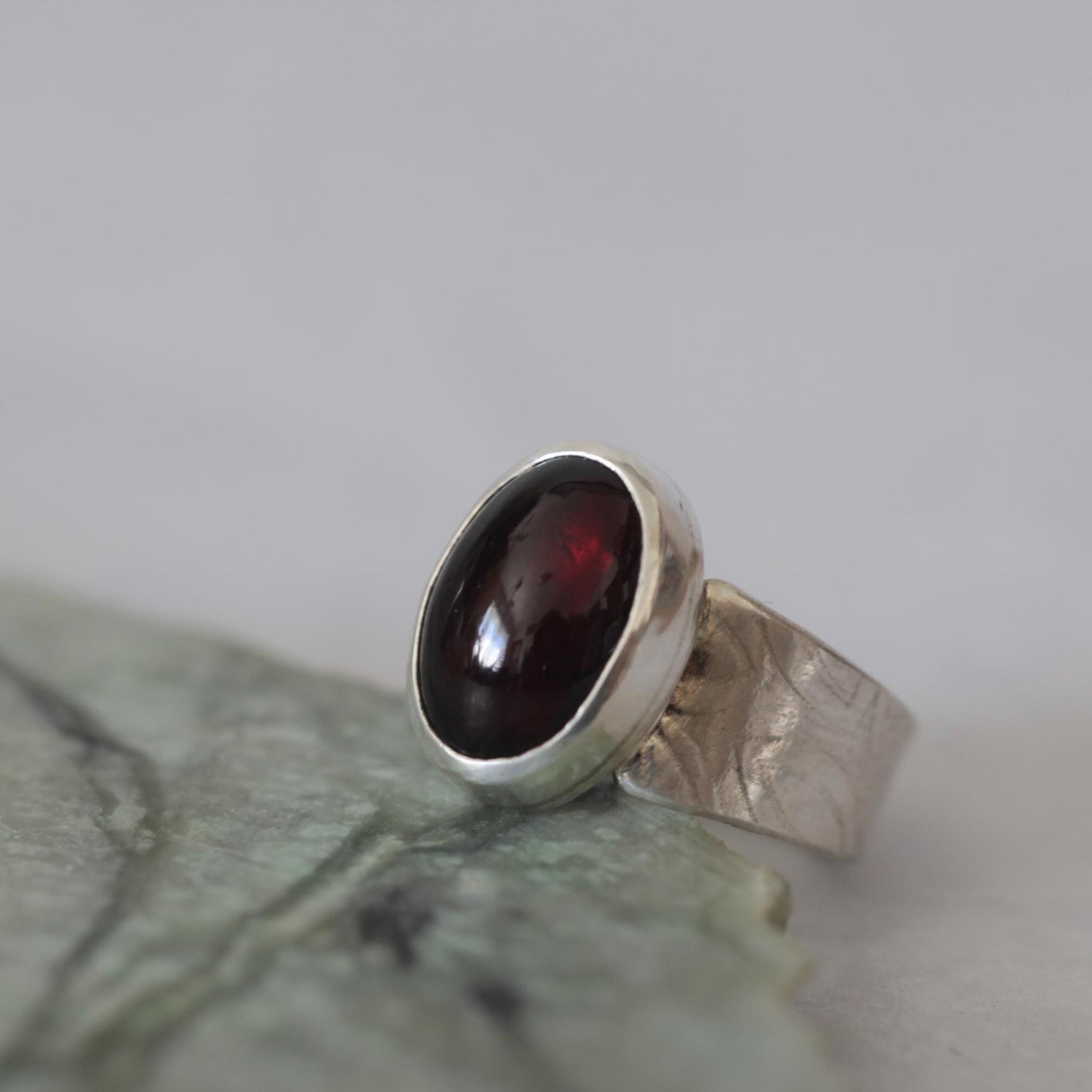 Moody Oval Red Garnet on Tapered Sterling Silver Band size 7.5