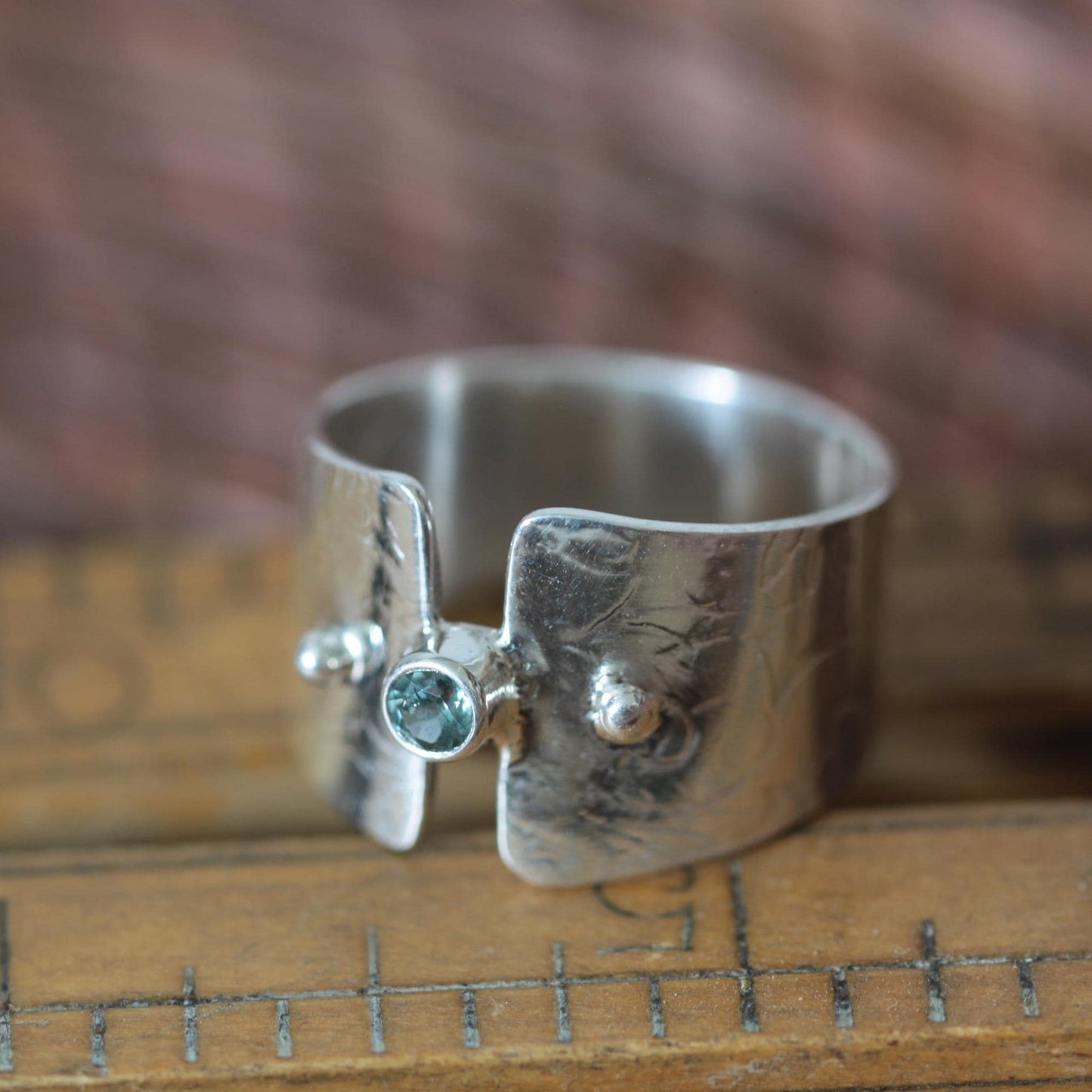 Montana Glacial Blue Sapphire on Wide Sterling Silver Band with Intricate Roll Print Design