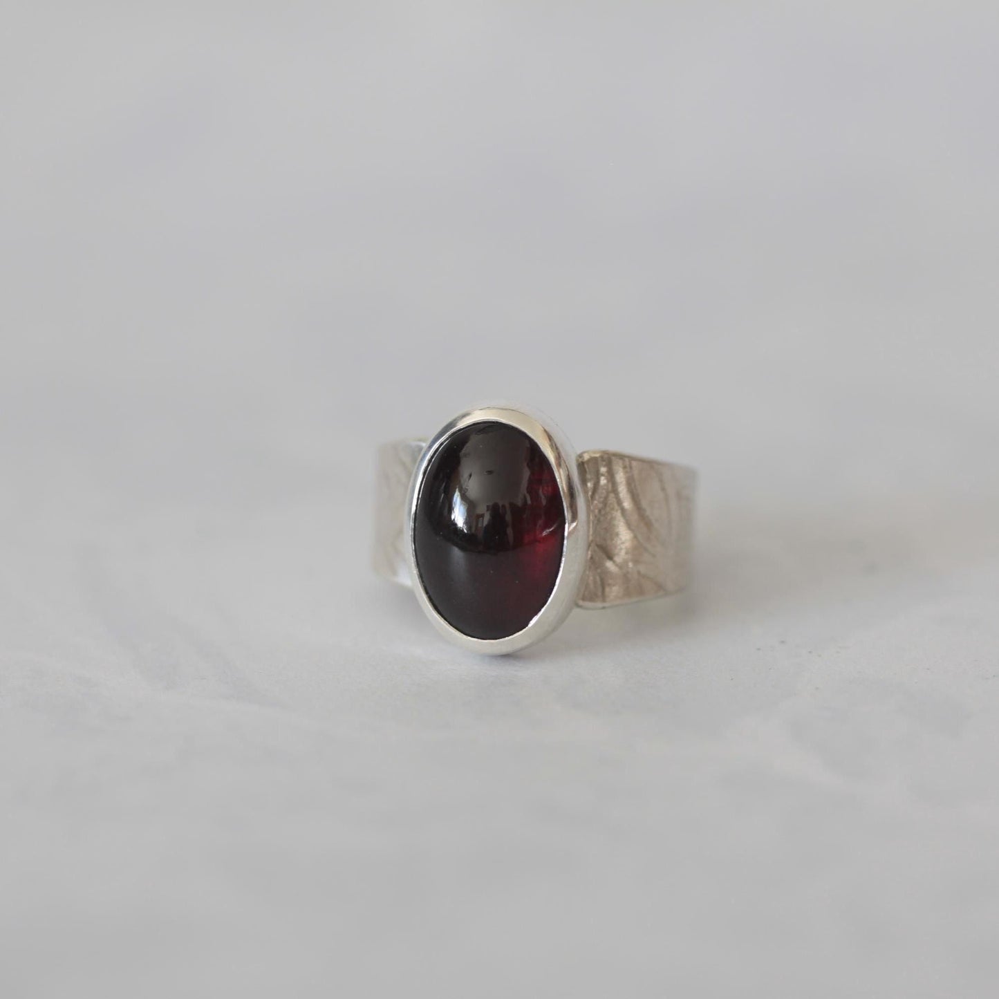 Moody Oval Red Garnet on Tapered Sterling Silver Band size 7.5