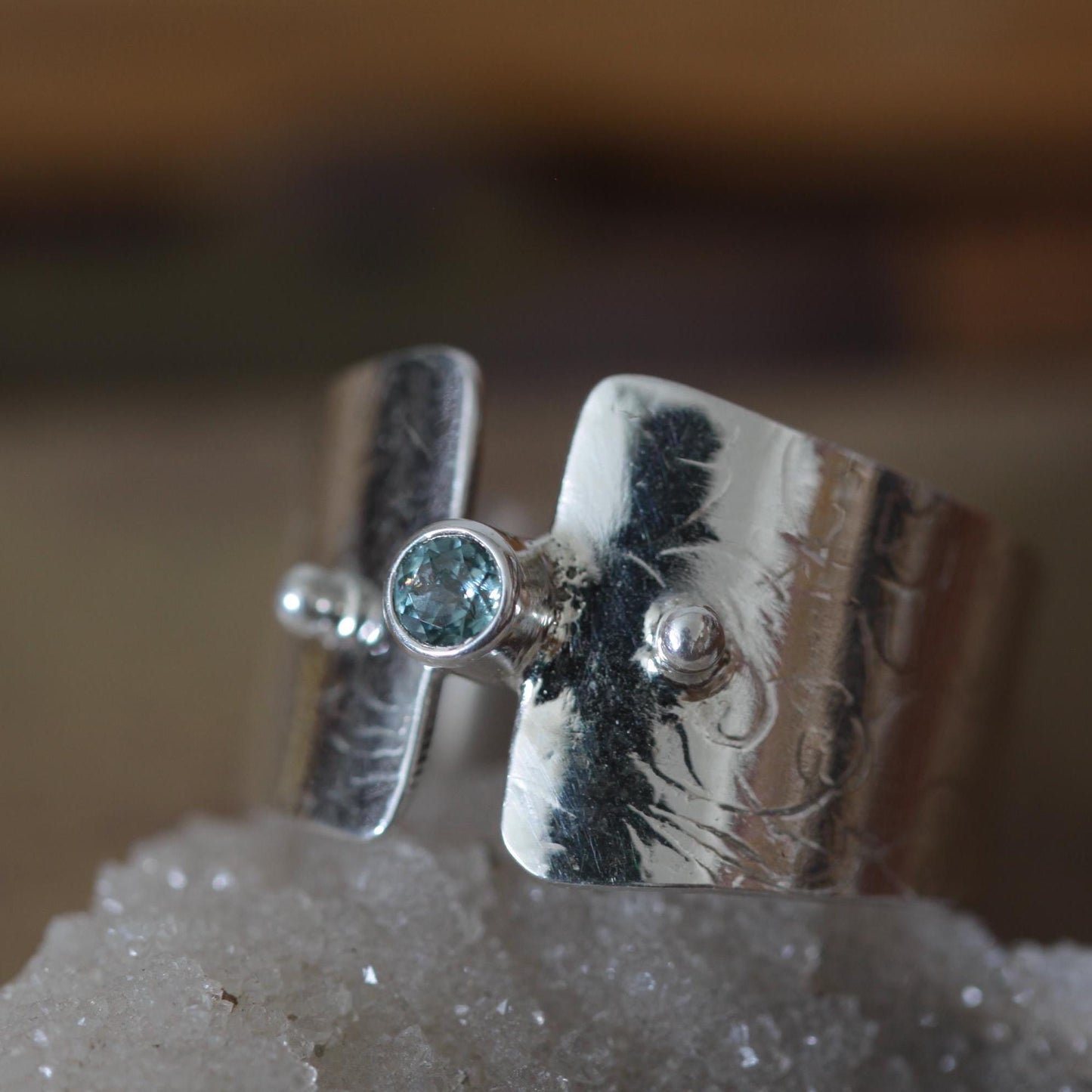 Montana Glacial Blue Sapphire on Wide Sterling Silver Band with Intricate Roll Print Design